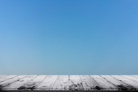 Empty wooden floor with blue sky background. For display or montage your products.