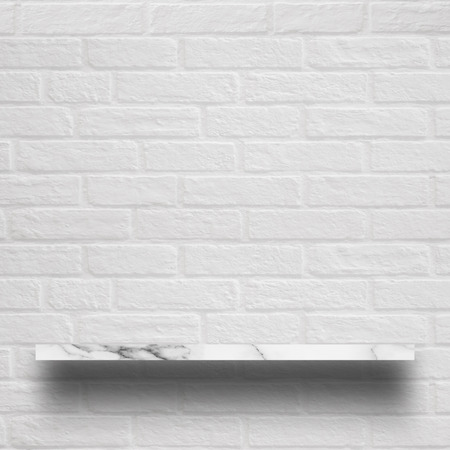 Empty top of white marble shelf with brick wall. For display or montage your products.の写真素材