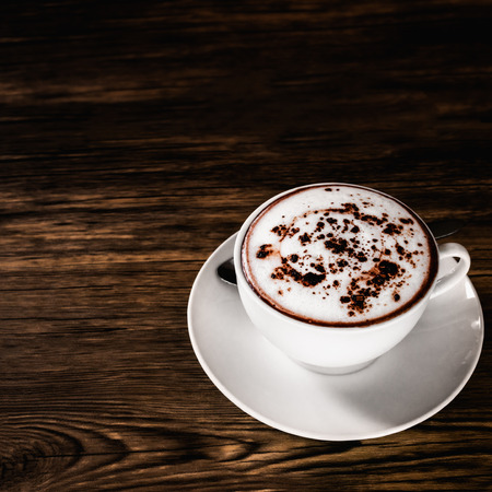 Hot chocolate cup on wood table background.の写真素材