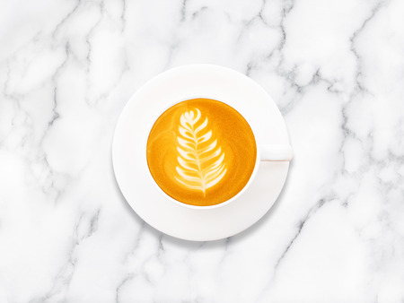 Top view of hot coffee cup on white marblle table background.の写真素材