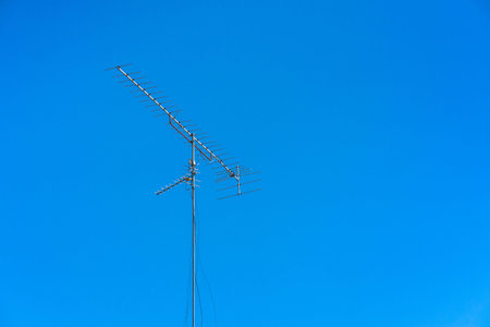 TV antenna with blue sky background.の写真素材