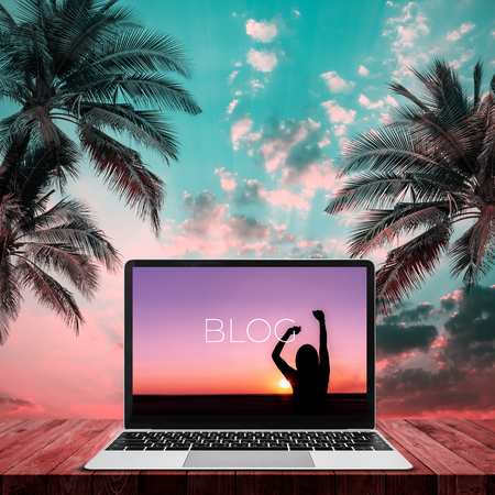 Blog social media information connect concept on laptop with sunset background.の写真素材