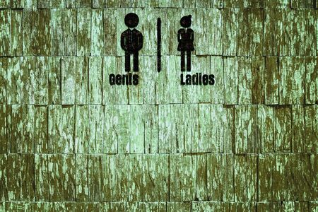 Toilet sign on wood texture background.の写真素材
