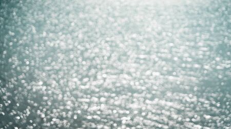 Abstract blur or bokeh light on sea background in summer.の写真素材