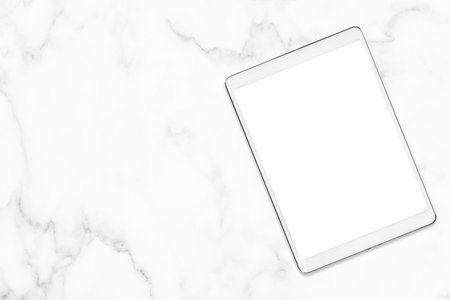Blank white tablet on marble table background.の写真素材