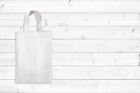 White fabric bag on wood table for background.の写真素材