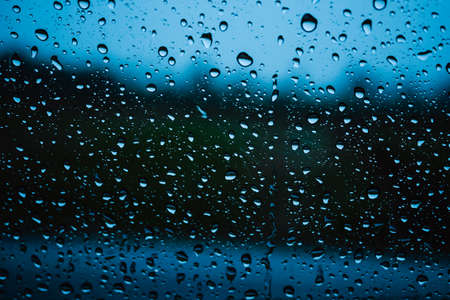 Close up raindrop on glass car in the rainy season.の写真素材