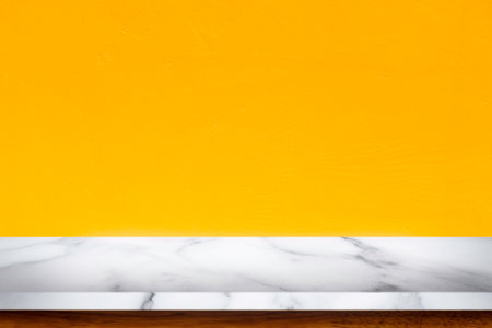 Empty top of white marble table with yellow concrete textured wall background.の写真素材