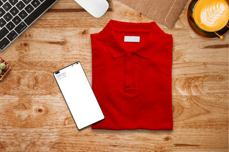 Red polo t-shirt on the desk to send as a gift on Chinese New Year.の写真素材
