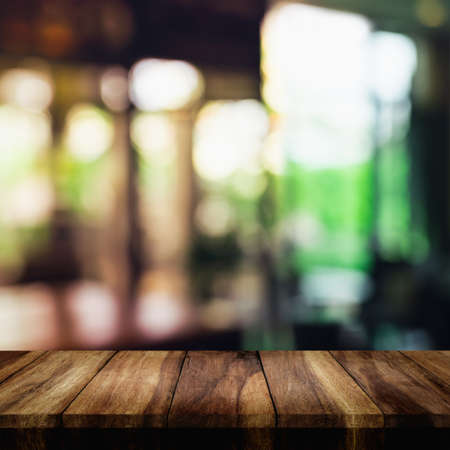 Empty top of wood table with blur interior living room for background.の写真素材