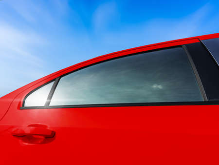 New tint film of the red car window.の写真素材
