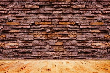 Empty wood floor texture with decorative stone wall background.の写真素材