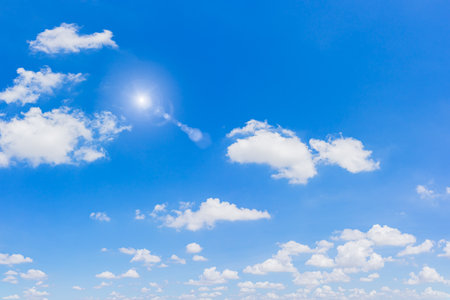 Beautiful blue sky and clouds with sun and daylight natural background.の写真素材