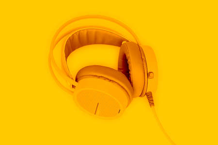 Yellow headphone on yellow background.の写真素材