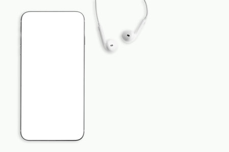 Smartphone and earphones on white background.の写真素材