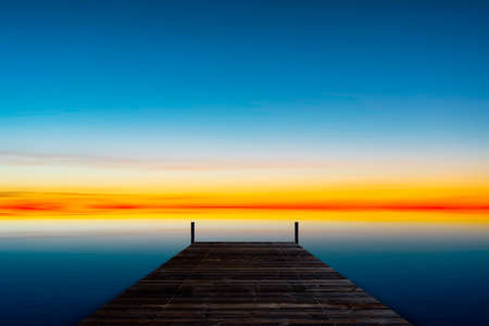 Old wooden pier with the sea in summer morning.の写真素材