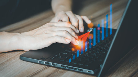 Charts from laptop with analysis of financial, technology, banking and investment concepts,...