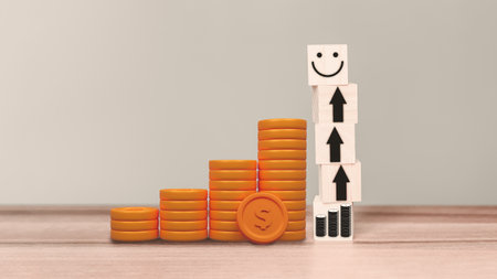 Pile of golden money coins with arrow leads to happy icon on wooden cube. Business growth under the concept âhappy moneyâ from delivering good things to customers.の写真素材