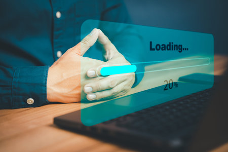 Man using laptop for download and waiting to loading digital business data form website, concept of...