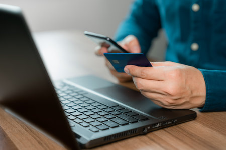 Man using credit card for purchasing and shopping online on mobile phone. Mobile payment with wallet app technology. Digital money transfer, banking and e commerce concept.の写真素材