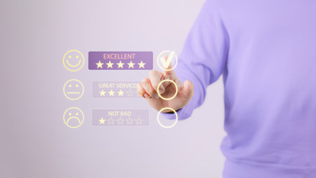 Man touching the virtual screen on the happy smiley face icon to give satisfaction in service. Rating very impressed. Customer service, testimonial and satisfaction concept.の写真素材