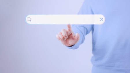 Man hand presses the information search button on computer touch screen. Technology, searching...
