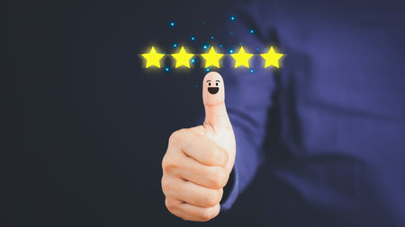 Thumb up for the positive emotion and five star smiley face icon with copy space. Customer...
