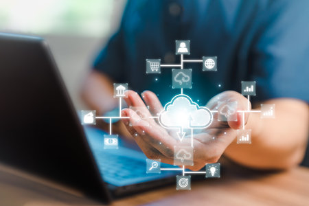 Businessman working at cloud data icon, cloud computing diagram show on hand. Cloud technology. Data storage. Networking and internet service concept.の写真素材