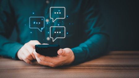 Man hand using smartphone typing live chat chatting on application communication digital web and social network concept. Social media application chat box.の写真素材