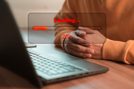 Man using laptop for download software and waiting to loading digital business data form website,...