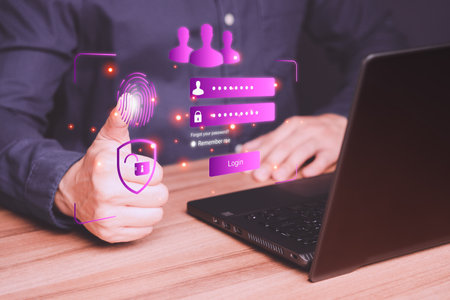 Man protecting personal data on a computer laptop and virtual interface. Cyber security concept to protect data. Secure encryption and access to the user's private information to access the internet.の写真素材