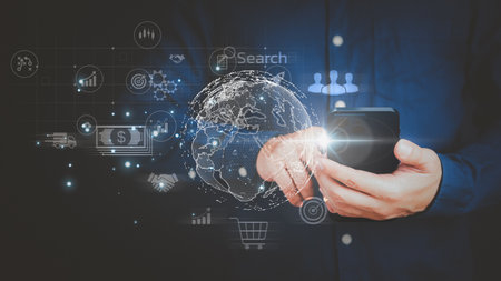Businessman holding and using mobile phone or smartphone. Concept of Business global internet connection application technology and digital marketing, Teamwork, Leadership, Financial, big data.の写真素材