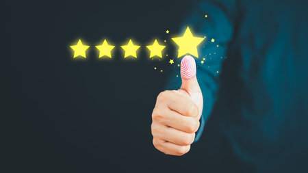 Man give positive reviews for customer satisfaction surveys, Five star rating, Customer assessment feedback, Service rating satisfaction and testimonial concept.の写真素材