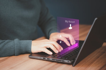 Man protecting personal data on computer laptop and virtual interface. Cyber security concept to protect data. Sign in encryption and access to the user's private information to access the internet.の写真素材