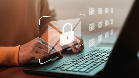 Freelancer's hand using computer laptop and sending online message with email icon, email marketing concept, send email or newsletter, internet network working online.の写真素材