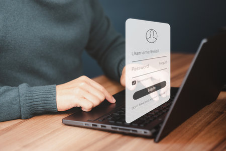 Man protecting personal data on a computer laptop and virtual interface. Cyber security concept to protect data. Secure encryption and access to the user's private information to access the internet.の写真素材