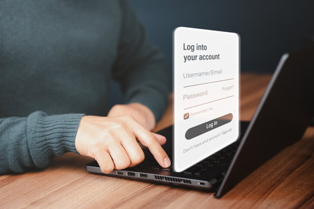 Man protecting personal data on a computer laptop and virtual interface. Cyber security concept to protect data. Secure encryption and access to the user's private information to access the internet.の写真素材