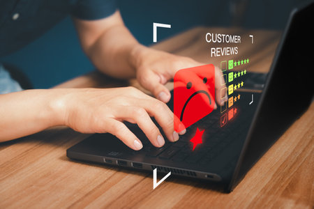 Unhappy man customer with sad emotion face on laptop. Bad review and service dislike poor quality, low rating, bad social media not good. Customer experience dissatisfied and testimonial concept.の写真素材
