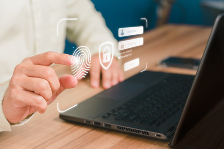Man login with fingerprint scanning technology in the computer. Secure encryption and access to the user's private information to access the Internet.の写真素材