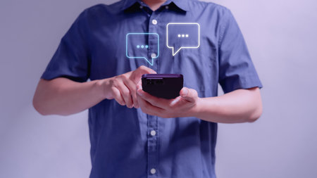 Man hand using smartphone typing live chat chatting on application communication digital web and...