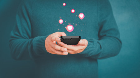 Man using a mobile phone with social media. Concept of living on vacation and playing social media on smartphone, social media and digital online and free time.の写真素材