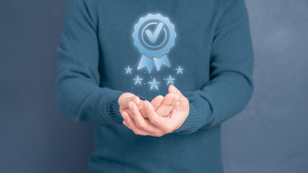 Quality assurance of business services, Businessman holding and showing the best quality assurance with golden five stars. Guarantee, Standards, ISO certification and testimonial concept.の写真素材
