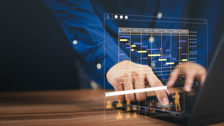 Man working with technology computer in Business Analytics and Data Management System to make report with KPI and metrics connected to database. Corporate strategy for operations, planing, marketing.の写真素材