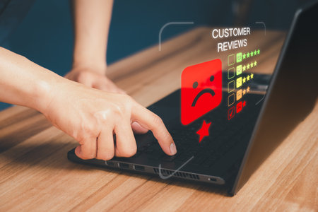 Unhappy man customer with sad emotion face on laptop. Bad review and service dislike poor quality, low rating, bad social media not good. Customer experience dissatisfied and testimonial concept.の写真素材