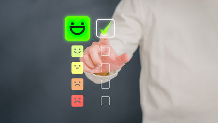 Man touching the virtual screen on the happy smiley face icon to give satisfaction in service. Rating very impressed. Customer service, testimonial and satisfaction concept.の写真素材