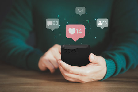 Man play on a mobile phone with social media. Concept of living on vacation and playing social media on smartphone, social media and digital online and free time.の写真素材