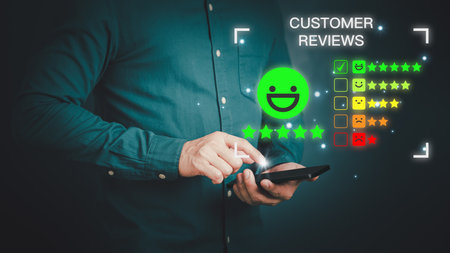 Man using a mobile phone or smartphone in give rating to service experience assessment on application. Online customer review satisfaction feedback survey and testimonial.の写真素材