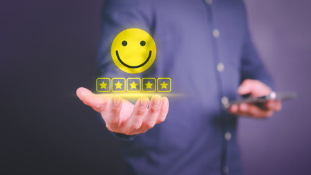 Businessman hand show happy smile face with 5 star. Positive review and feedback. Assessment customer services best excellent business rating experience, satisfaction survey and testimonial concept.の写真素材