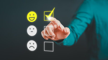 Man touching the virtual screen on the happy smiley face icon to give satisfaction in service. Rating very impressed. Assessment customer service, testimonial and satisfaction concept.の写真素材