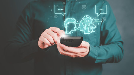 ChatGPT Chat with AI, Artificial Intelligence. Adult man chatting with a smart AI or artificial intelligence using an artificial intelligence chatbot developed, Futuristic technology transformation.の写真素材